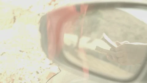 HANDS COUNT MONEY IN SIDEVIEW MIRROR Stock Footage 159573556