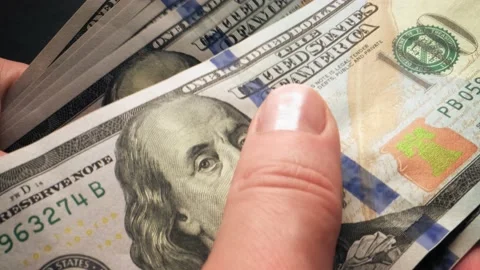 Hands count one hundred dollar bills Stock Footage 165452691