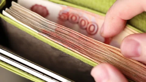 Hands count ruble banknotes in a green wallet close-up. Cash, five thousand Stock Footage 163010296