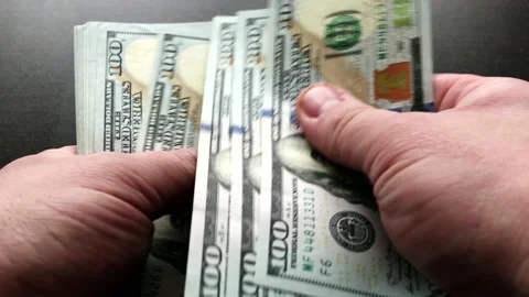 Hands count stack of bills one hundred dollars US Stock Footage 148709930