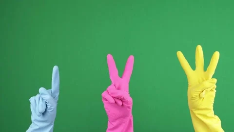 Hands counting from 1 to 3. Three hands with protective rubber gloves show one 動画素材 156079312