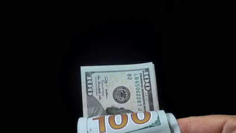 Hands counting bundle of dollar bills in 4K Video stock 150727628