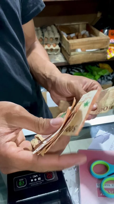 Hands Counting Cash at Store Counter Vertical Stock Footage 325090091