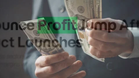 Hands Counting Dollar Bills with Blurred Profit Jump Text Stock Footage 337732978