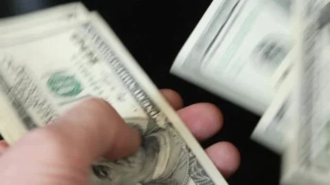 Hands counting dollar cash on black background. Concept of saving, planning 스톡 동영상 336263223