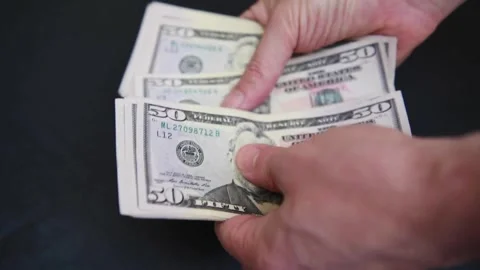 Hands counting dollar cash on black background. Concept of saving, planning Stock-Footage 336263316