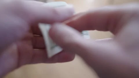 Hands Counting Dollars: Close-Ups of $100 Bills Stock Footage 314390224