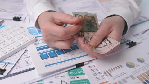 Hands counting dollars Stock Photos