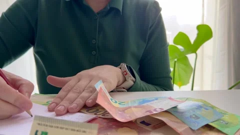 Hands counting euro banknotes on a table Stock Footage 324784730