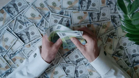 Hands Counting Hundred Euro Notes Above Dollar Banknotes Stockbeeldmateriaal 336710507