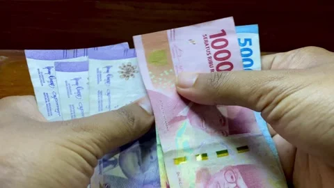 Hands Counting Indonesian Banknotes Close-Up Stock Footage 327348259