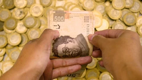 Hands Counting slow Mexican money Stock Footage 126565636