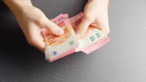 Hands counting a stack of 10 Euro banknotes. Expenses, income, Finance and .. Stock-Footage 265885494