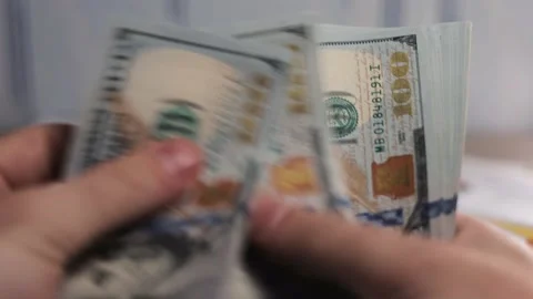 Hands counting stack of cash dollar notes Stock Footage 137916972