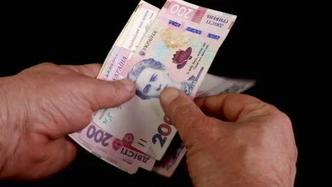Hands counting stack cash two hundred Ukrainian hryvnia bills, recalculation Stock Footage 201532788