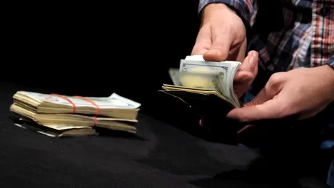 Hands counting stack of dollars in slow motion. Stock Footage 129786468