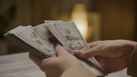 Hands Counting a Stack of One Hundred Dollar Bills Stock Footage 280227613