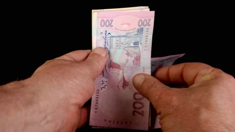 Hands counting stack two hundred Ukrainian hrywnia Stock Footage 202075444