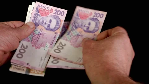 Hands counting stack two hundred Ukrainian hrywnia Stock Footage 202075486