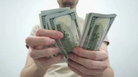 Hands counting stacks of US dollar bills. Financial and banking concepts. Stock Footage 286906338