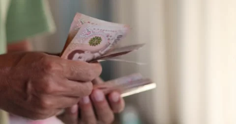 Hands counting Thai banknotes, money Thai Baht, cash, personal finance, inc.. Stock Footage 340440265