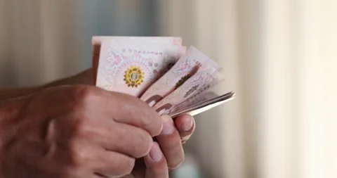 Hands counting Thai banknotes, money Thai Baht, cash, personal finance, inc.. Stock Footage 341558325