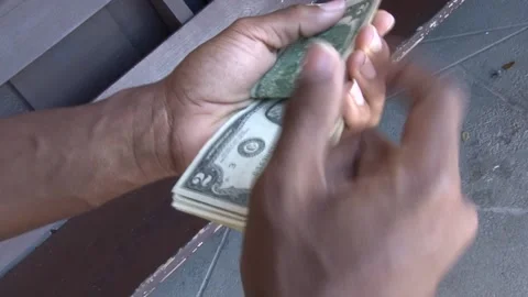 Hands counting two dollar bills Video stock 138964593