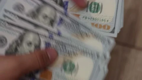 Hands counting US Dollar bills or paying in cash on money background. Stock Footage 143117614
