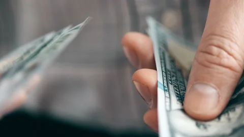 Hands counting US Dollar bills or paying in cash on money background. Stock Footage 169265195