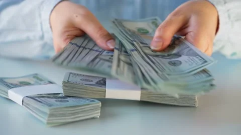 Hands counting US Dollar bills or paying in cash. Concept of investment, success Stock Footage 182621719
