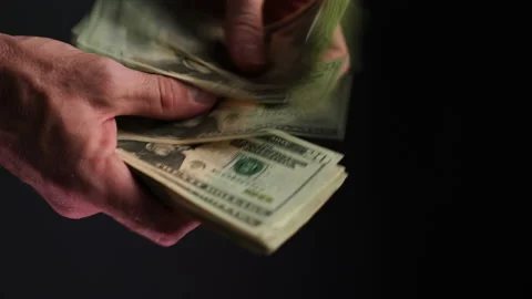 Hands counting us dollars in 4k Stock Footage 217997840