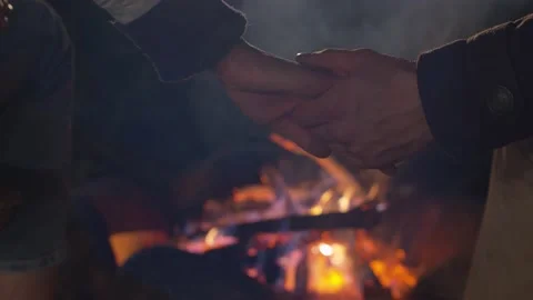 Hands of couple on the against the fire Stock-Footage 130866252