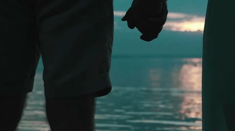 Hands of a couple come together at sunset on the beach ,slow motion 스톡 동영상 68935013