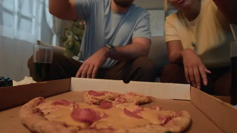 Hands of Couple Taking Pizza Slices Out of Delivery Box Enjoying Takeout Dinner Stock Footage 332697673