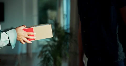 Hands, courier and client with package at front door, service and shipping for Stock Footage 318796779