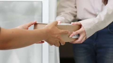 Hands courier delivery man sending box parcel to customer, delivery Stock Footage 196935255