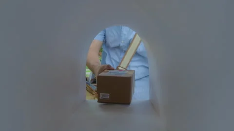 Hands of Courier Putting Parcel Boxes into Mailbox Stock Footage 279268813