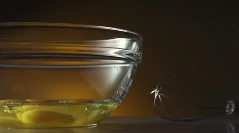 Hands Cracking an Egg into a Bowl of Flour Stock Footage 21432294