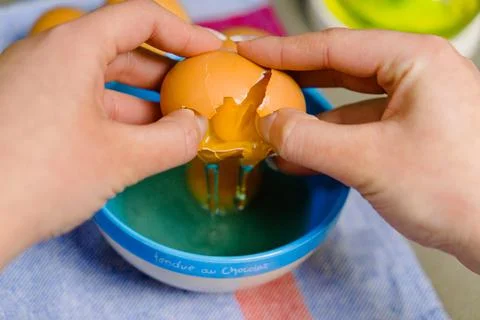 Hands cracking an egg for some kind of recipes Stock Photos