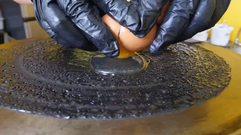 Hands Cracking Fresh Egg onto Hot Crepe Plate Street Food Cooking Stock Footage 345692712