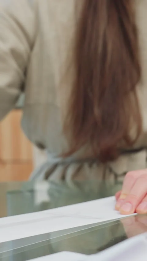 Hands craft booklet, Close shot of hands constructing mini zine with glue Stock Footage 329536301