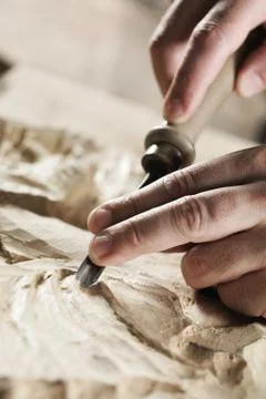 Hands of a craftsman Stock Photos