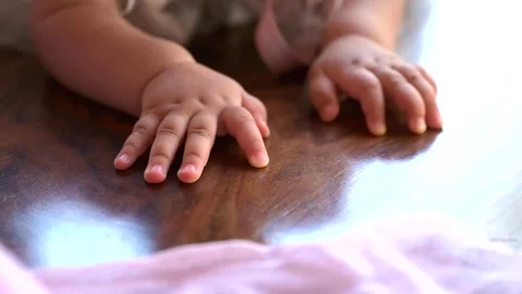 Hands of a crawling baby Video stock 245432262