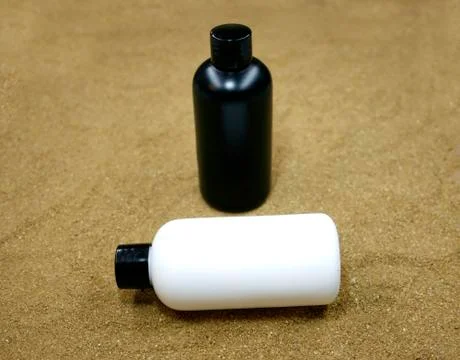 Hands cream bottom on sand Foto stock