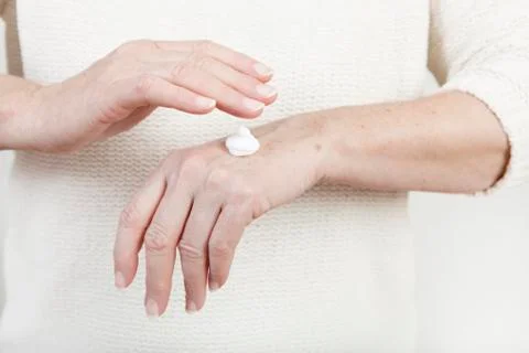 Hands with cream Stock Photos