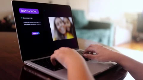 Hands creating AI video content on laptop in home office workspace Stock Footage 313095585