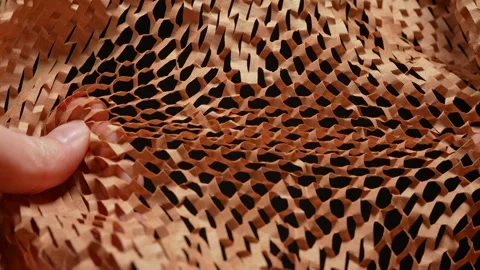 Hands crinkle and tear packaging material for parcels. Craft brown honeycomb 스톡 동영상 271088847