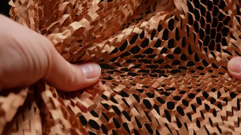 Hands crinkle and tear packaging material for parcels. Craft brown honeycomb 스톡 동영상 271088948