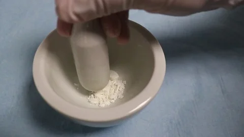 The hands  crushes medicines . Stock Footage 78507315