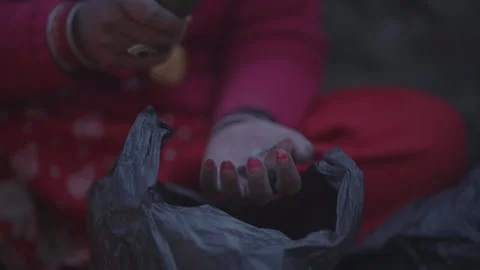 Hands crushing dried herbal material with stone tool in Nepal Stock Footage 342140575